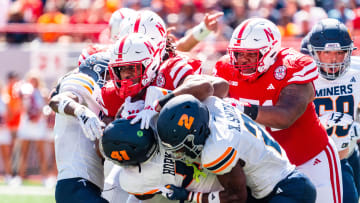 Aug 31, 2024; Lincoln, Nebraska, USA; Nebraska Cornhuskers running back Dante Dowdell (23) runs against UTEP Miners linebacker Dorian Hopkins (41) and safety Xavier Smith (2) during the first quarter at Memorial Stadium. Mandatory Credit: Dylan Widger-USA TODAY Sports