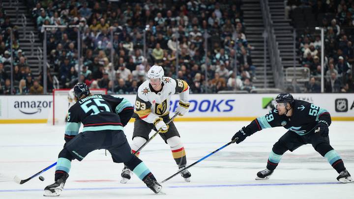Oct 6, 2026; Seattle, Washington, USA; Vegas Golden Knights right wing Mitch Marner (93) defends Seattle Kraken defenseman Ryan Lindgren (55) during the first period at Climate Pledge Arena. Mandatory Credit: Steven Bisig-Imagn Images