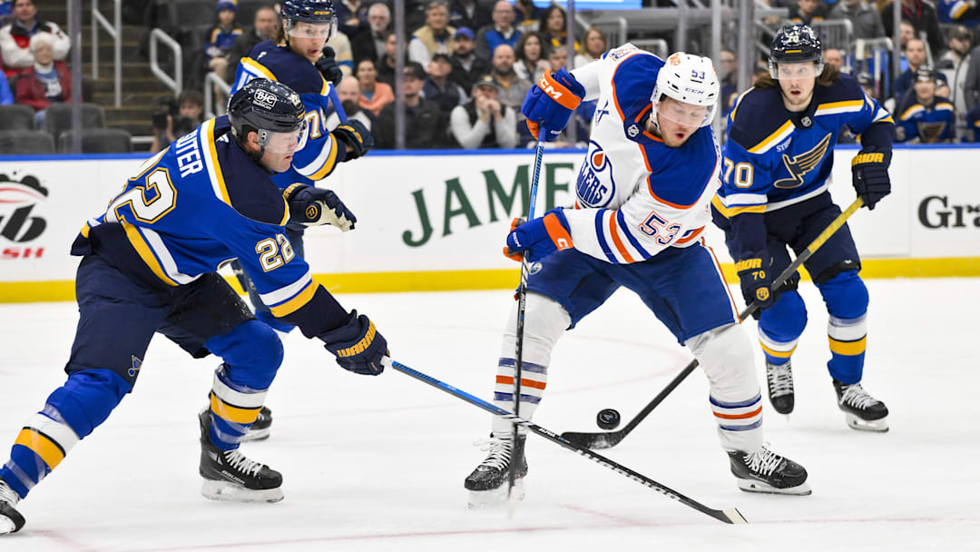 Feb 4, 2025; St. Louis, Missouri, USA;  Edmonton Oilers center Jeff Skinner (53) shoots as St. Louis Blues defenseman Ryan Suter (22) defends during the first period at Enterprise Center. Mandatory Credit: Jeff Curry-Imagn Images
