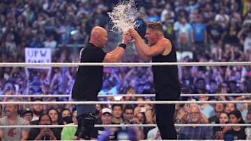 Stone Cold Steve Austin and Pat McAfee toast beer during WrestleMania at AT&T Stadium. 