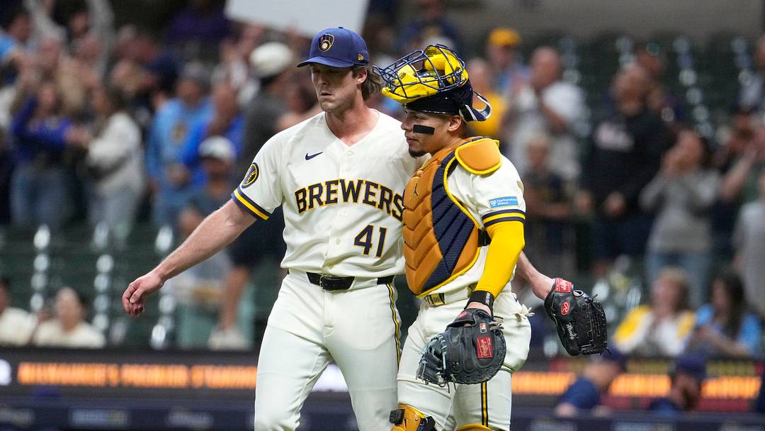Jun 1, 2026; Milwaukee, Wisconsin, USA; Milwaukee Brewers pitcher Jake Woodford (41) and catcher William Contreras (24) celebrate a 16-2 win over the San Francisco Giants at American Family Field. Mandatory Credit: Michael McLoone-Imagn Images