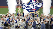 Nov 1, 2025; Toronto, Ontario, CAN; The Los Angeles Dodgers celebrate on the podium after defeating the Toronto Blue Jays in game seven of the 2025 MLB World Series at Rogers Centre. Mandatory Credit: Kevin Sousa-Imagn Images
