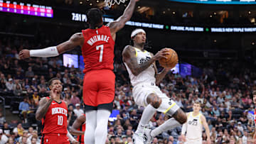 Oct 7, 2024; Salt Lake City, Utah, USA; Utah Jazz guard Jordan Clarkson (00) goes to the basket against Houston Rockets forward Cam Whitmore (7) during the second quarter at Delta Center. Mandatory Credit: Rob Gray-Imagn Images