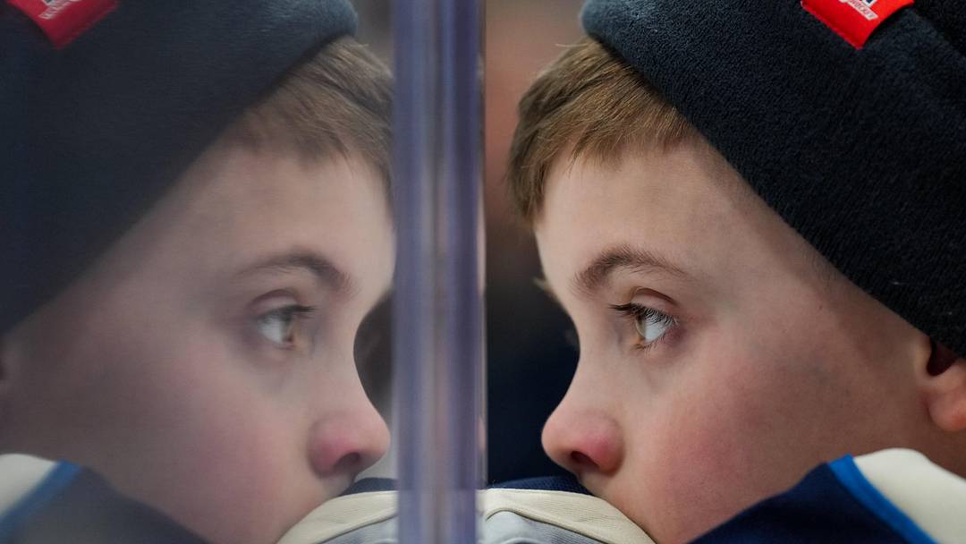 Feb 28, 2026; Columbus, Ohio, USA;  A young fan watches the game between the New York Islanders and the Columbus Blue Jackets in the second period at Nationwide Arena. Mandatory Credit: Aaron Doster-Imagn Images