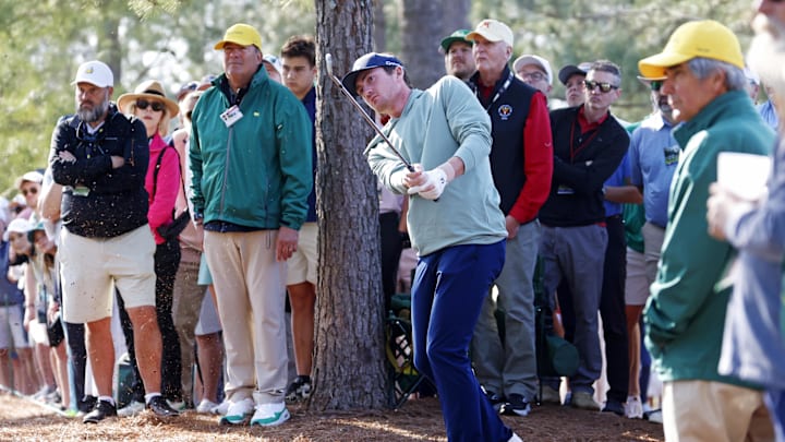 Nick Dunlap plays from the pine straw on the first fairway during the first round of the Masters Tournament