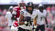 Purdue Boilermakers running back Devin Mockobee (45) rushes with the football 