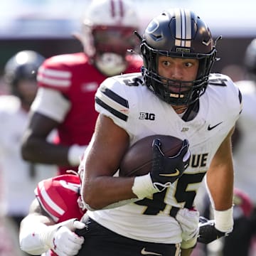 Purdue Boilermakers running back Devin Mockobee (45) rushes with the football 