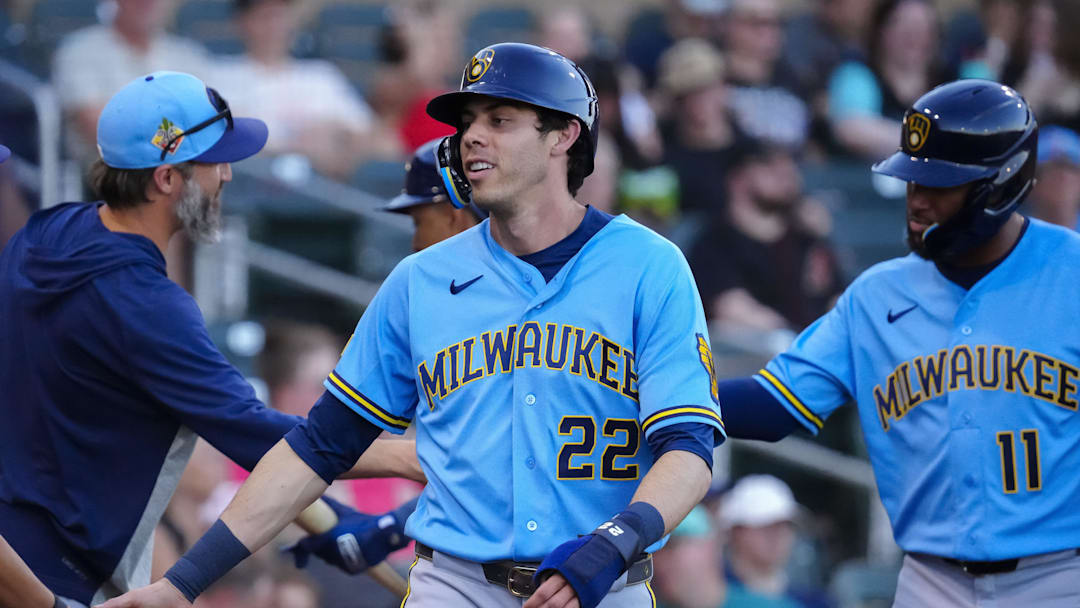 Brewers outfielder Christian Yelich (22) celebrates scoring against the Diamondbacks during a spring training game at Salt River Fields on March 20, 2026.