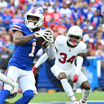 Sep 8, 2024; Orchard Park, New York, USA; Buffalo Bills wide receiver Curtis Samuel (1) is tackled by Arizona Cardinals cornerback Sean Murphy-Bunting (23) after a catch in the second quarter at Highmark Stadium.