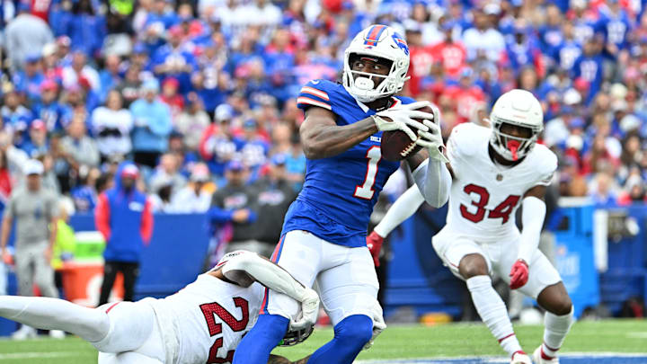 Sep 8, 2024; Orchard Park, New York, USA; Buffalo Bills wide receiver Curtis Samuel (1) is tackled by Arizona Cardinals cornerback Sean Murphy-Bunting (23) after a catch in the second quarter at Highmark Stadium.