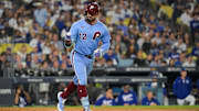 Oct 8, 2025; Los Angeles, California, USA; Philadelphia Phillies designated hitter Kyle Schwarber (12) celebrates after hitting a solo home run during the fourth inning against the Los Angeles Dodgers during game three of the NLDS round for the 2025 MLB playoffs at Dodger Stadium. Mandatory Credit: Jayne Kamin-Oncea-Imagn Images