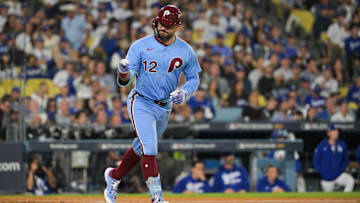 Oct 8, 2025; Los Angeles, California, USA; Philadelphia Phillies designated hitter Kyle Schwarber (12) celebrates after hitting a solo home run during the fourth inning against the Los Angeles Dodgers during game three of the NLDS round for the 2025 MLB playoffs at Dodger Stadium. Mandatory Credit: Jayne Kamin-Oncea-Imagn Images