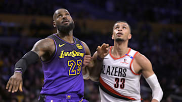 Jan 2, 2025; Los Angeles, California, USA; Los Angeles Lakers forward LeBron James (23) boxes out Portland Trail Blazers forward Toumani Camara (33) in the first half at Crypto.com Arena. Mandatory Credit: Jayne Kamin-Oncea-Imagn Images