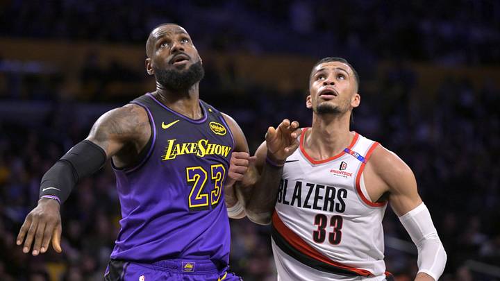 Jan 2, 2025; Los Angeles, California, USA; Los Angeles Lakers forward LeBron James (23) boxes out Portland Trail Blazers forward Toumani Camara (33) in the first half at Crypto.com Arena. Mandatory Credit: Jayne Kamin-Oncea-Imagn Images