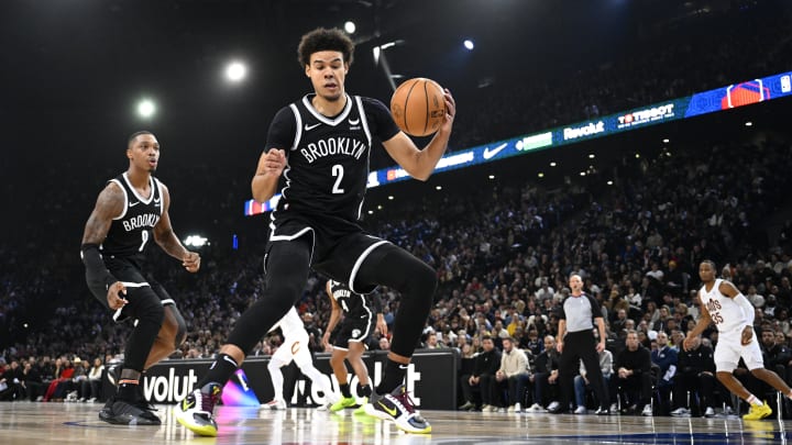 Jan 11, 2024; Paris, FRANCE; Brooklyn Nets forward Cameron Johnson (2) controls the ball against the Cleveland Cavaliers in the NBA Paris Game at AccorHotels Arena. Mandatory Credit:  Alexis Reau/Presse Sports via USA TODAY Sports