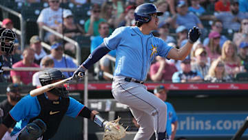 Mar 11, 2023; Jupiter, Florida, USA;  Tampa Bay Rays third baseman Austin Shenton (93) hits a double against the Miami Marlins in the third inning at Roger Dean Stadium. Mandatory Credit: Jim Rassol-Imagn Images