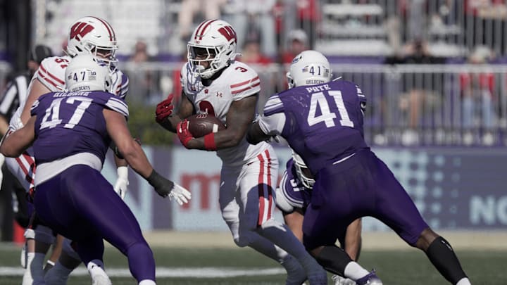 Oct 19, 2024; Evanston, Illinois, USA; Wisconsin running back Tawee Walker (3) cuts against the grain during the second quarter of their game against Northwestern Saturday October 19, 2024 at Lanny and Sharon Martin Stadium in Evanston, Illinois. Mandatory Credit: Mark Hoffman/USA TODAY Network via Imagn Images Oct 19, 2024; Evanston, Illinois, USA; Wisconsin running back Tawee Walker (3) cuts against the grain during the second quarter of their game against Northwestern Saturday October 19, 2024 at Lanny and Sharon Martin Stadium in Evanston, Illinois. Mandatory Credit: Mark Hoffman/USA TODAY Network via Imagn Images