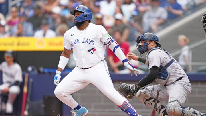 Jun 30, 2024; Toronto, Ontario, CAN; Toronto Blue Jays first base Vladimir Guerrero Jr. (27) reacts after hitting a single against the New York Yankees during the first inning at Rogers Centre.