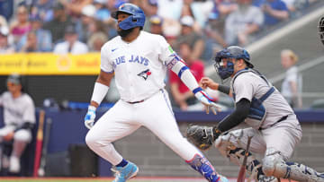 Jun 30, 2024; Toronto, Ontario, CAN; Toronto Blue Jays first base Vladimir Guerrero Jr. (27) reacts after hitting a single against the New York Yankees during the first inning at Rogers Centre. Mandatory Credit: Nick Turchiaro-USA TODAY Sports