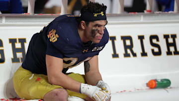 Jan 20, 2025; Atlanta, GA, USA; Notre Dame Fighting Irish linebacker Drayk Bowen (34) reacts on the bench after losing to the Ohio State Buckeyes in the CFP National Championship college football game at Mercedes-Benz Stadium. Mandatory Credit: Kirby Lee-Imagn Images