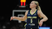 Jul 7, 2025; Phoenix, Arizona, USA; Dallas Wings guard Paige Bueckers (5) shoots against the Phoenix Mercury in the first half at Footprint Center. Mandatory Credit: Rick Scuteri-Imagn Images