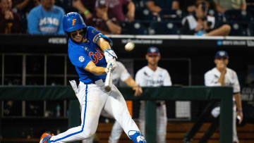 Jun 15, 2024; Omaha, NE, USA; Florida Gators second baseman Cade Kurland (4) flies out to right field against the Texas A&M Aggies during the ninth inning at Charles Schwab Field Omaha. Mandatory Credit: Dylan Widger-USA TODAY Sports