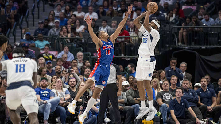 Oct 20, 2023; Dallas, Texas, USA; Dallas Mavericks forward Markieff Morris (88) shoots over Detroit Pistons forward Tosan Evbuomwan (18) during the second half at the American Airlines Center. Mandatory Credit: Jerome Miron-Imagn Images