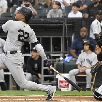 Aug 14, 2024; Chicago, Illinois, USA;  New York Yankees outfielder Juan Soto (22) hits a home run against the Chicago White Sox during the first inning at Guaranteed Rate Field.