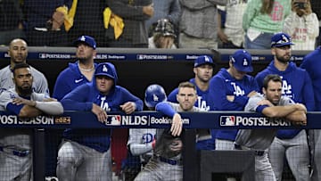 Oct 8, 2024; San Diego, California, USA; Los Angeles Dodgers players watch in the ninth inning against the San Diego Padres during game three of the NLDS for the 2024 MLB Playoffs at Petco Park.  Mandatory Credit: Denis Poroy-Imagn Images
