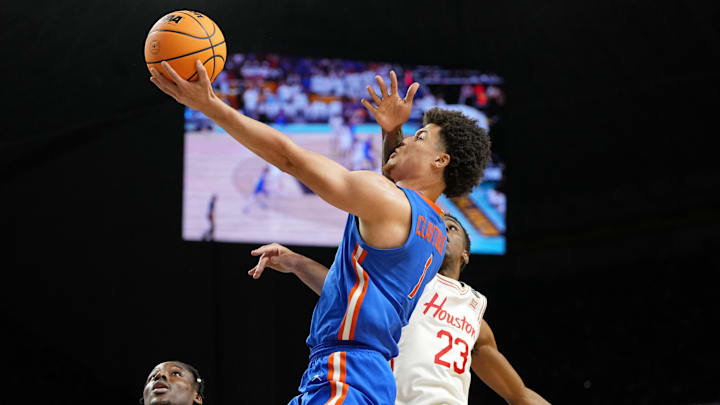 Apr 7, 2025; San Antonio, TX, USA; Florida Gators guard Walter Clayton Jr. (1) shoots the ball as Houston Cougars guard Terrance Arceneaux (23) attempts a block during the second half of the national championship game of the Final Four of the 2025 NCAA Tournament at the Alamodome. Mandatory Credit: Bob Donnan-Imagn Images