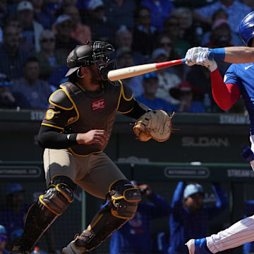 Mar 4, 2025; Mesa, Arizona, USA; Chicago Cubs outfielder Kyle Tucker (30) hits an RBI sacrifice fly out against the San Diego Padres in the third inning at Sloan Park.