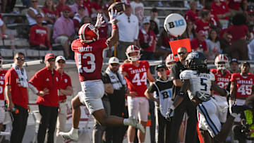 Aug 30, 2025; Bloomington, Indiana, USA; Indiana Hoosiers wide receiver Elijah Sarratt (13) catches a pass in front of Old Dominion Monarchs cornerback Brandon Crutchfield (5) during the second half at Memorial Stadium. Mandatory Credit: Robert Goddin-Imagn Images