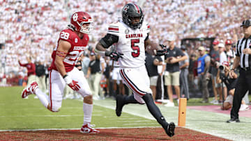 Oct 19, 2024; Norman, Oklahoma, USA;  South Carolina Gamecocks running back Raheim Sanders (5) scores a touchdown past Oklahoma Sooners linebacker Danny Stutsman (28) during the first half at Gaylord Family-Oklahoma Memorial Stadium. Mandatory Credit: Kevin Jairaj-Imagn Images