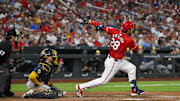 Sep 19, 2025; St. Louis, Missouri, USA;  St. Louis Cardinals third baseman Nolan Arenado (28) hits a three run double against the Milwaukee Brewers during the fifth inning at Busch Stadium. Mandatory Credit: Jeff Curry-Imagn Images