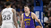Apr 9, 2025; Dallas, Texas, USA; Dallas Mavericks forward P.J. Washington (25) and Los Angeles Lakers guard Luka Doncic (77) in action during the game between the Dallas Mavericks and the Los Angeles Lakers at American Airlines Center. Mandatory Credit: Jerome Miron-Imagn Images