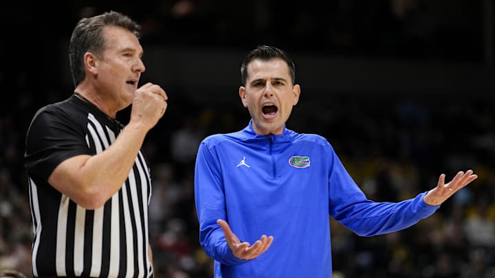 Jan 20, 2024; Columbia, Missouri, USA; Florida Gators head coach Todd Golden talks with referee Doug Shows during the first half against the Missouri Tigers at Mizzou Arena. Mandatory Credit: Jay Biggerstaff-Imagn Images
