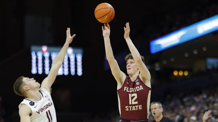 Charlottesville, Virginia, USA; Florida State Seminoles guard Tom House (12) shoots