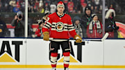  Dec 31, 2024; Chicago, Illinois, USA; Chicago Blackhawks center Philipp Kurashev (23) looks on during warmups before the Winter Classic against the St. Louis Blues at Wrigley Field. Mandatory Credit: Daniel Bartel-Imagn Images