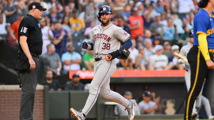 Jul 19, 2024; Seattle, Washington, USA; Houston Astros right fielder Trey Cabbage (38) scores a run against the Seattle Mariners during the third inning at T-Mobile Park. Mandatory Credit: Steven Bisig-USA TODAY Sports