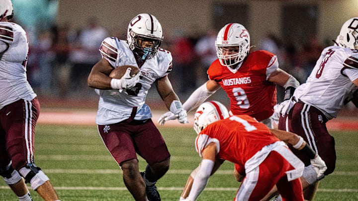 Dowling Catholic’s Ian Middleton (5) takes the ball forward down the field against DCG on Sept. 12, 2025, at Dallas Center-Grimes High School.