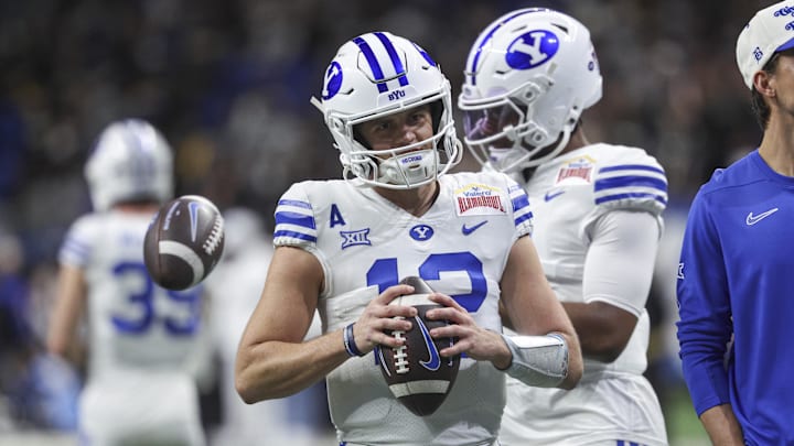 Brigham Young Cougars quarterback Jake Retzlaff warms up before a college football game against the Colorado Buffaloes Brigham Young Cougars quarterback Jake Retzlaff warms up before a college football game against the Colorado Buffaloes