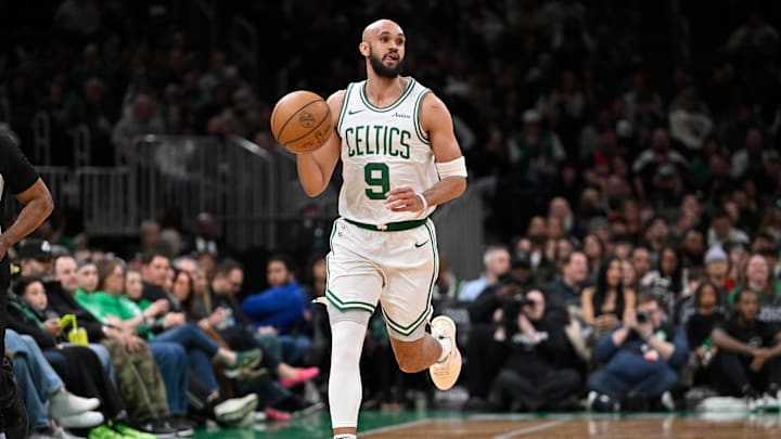 Apr 11, 2025; Boston, Massachusetts, USA; Boston Celtics guard Derrick White (9) dribbles the ball against the Charlotte Hornets during the first half at TD Garden. Mandatory Credit: Eric Canha-Imagn Images
