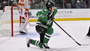Mar 6, 2025; Dallas, Texas, USA; Dallas Stars center Roope Hintz (24) gets up from the ice after being checked by the Calgary Flames during the second period at the American Airlines Center. Mandatory Credit: Jerome Miron-Imagn Images