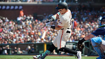 Aug 17, 2025; San Francisco, California, USA; San Francisco Giants right fielder Drew Gilbert (61) hits an RBI single against the Tampa Bay Rays during the eighth inning at Oracle Park. Mandatory Credit: Robert Edwards-Imagn Images