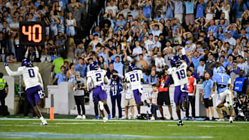 Sep 1, 2025; Chapel Hill, North Carolina, USA; TCU Horned Frogs safety Bud Clark (21) intercepts a pass and returns it for a touchdown in the second quarter at Kenan Stadium. Mandatory Credit: Bob Donnan-Imagn Images