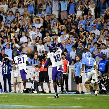Sep 1, 2025; Chapel Hill, North Carolina, USA; TCU Horned Frogs safety Bud Clark (21) intercepts a pass and returns it for a touchdown in the second quarter at Kenan Stadium. Mandatory Credit: Bob Donnan-Imagn Images