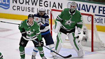 May 17, 2025; Dallas, Texas, USA; Winnipeg Jets center Mark Scheifele (55) checks Dallas Stars defenseman Esa Lindell (23) as goaltender Jake Oettinger (29) looks on during the first period in game six of the second round of the 2025 Stanley Cup Playoffs at American Airlines Center. Mandatory Credit: Jerome Miron-Imagn Images