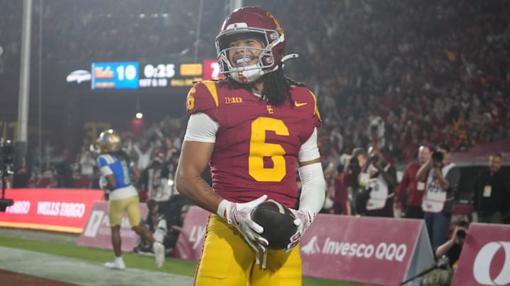 Nov 29, 2025; Los Angeles, California, USA; Southern California Trojans wide receiver Makai Lemon (6) celebrates after catching a 32-yard touchdown pass against the UCLA Bruins in the second half at United Airlines Field at Los Angeles Memorial Coliseum. Mandatory Credit: Kirby Lee-Imagn Images