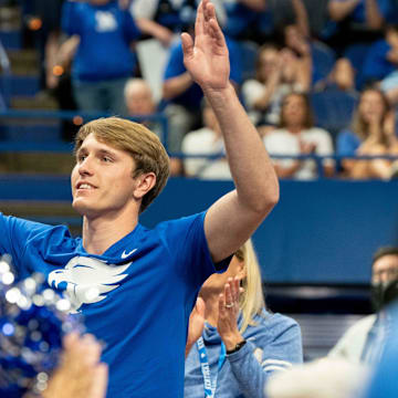 Recruit Travis Perry waves to the crowd during University of Kentucky’s men’s basketball coach Mark Pope’s introductory press conference on Sunday, April 14, 2024.