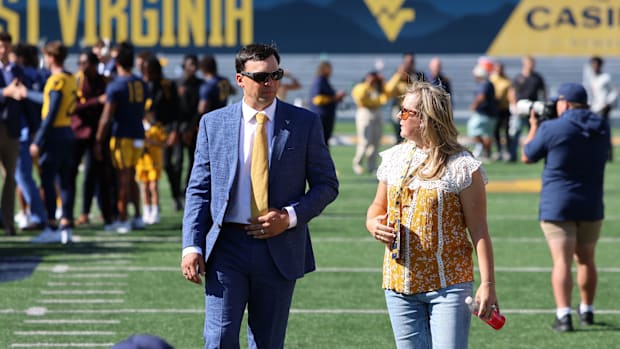 West Virginia University head coach Neal Brown with his wife Brooke. 